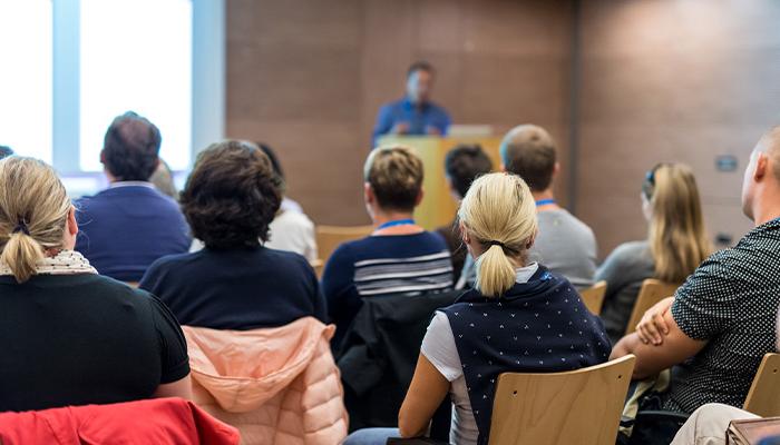 a public forum being held in a brick room