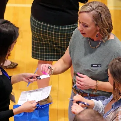 an employer talks with a student at the career fair